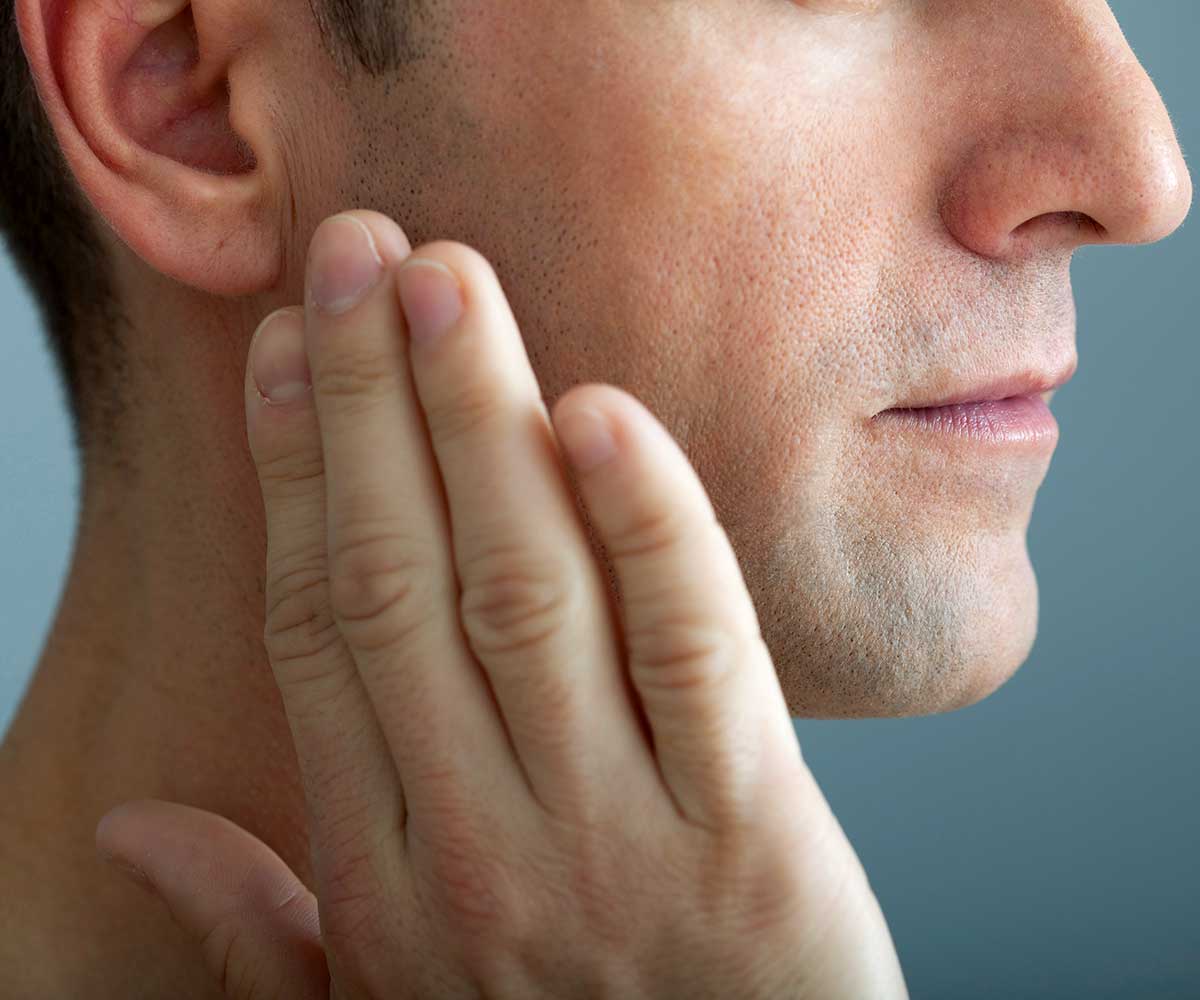ultima-dental-wellness-man-sore-tmd-joint-botox TMD Jaw Pain Botox | Ultima Dental Wellness | SW Calgary Dentist in Kingsland